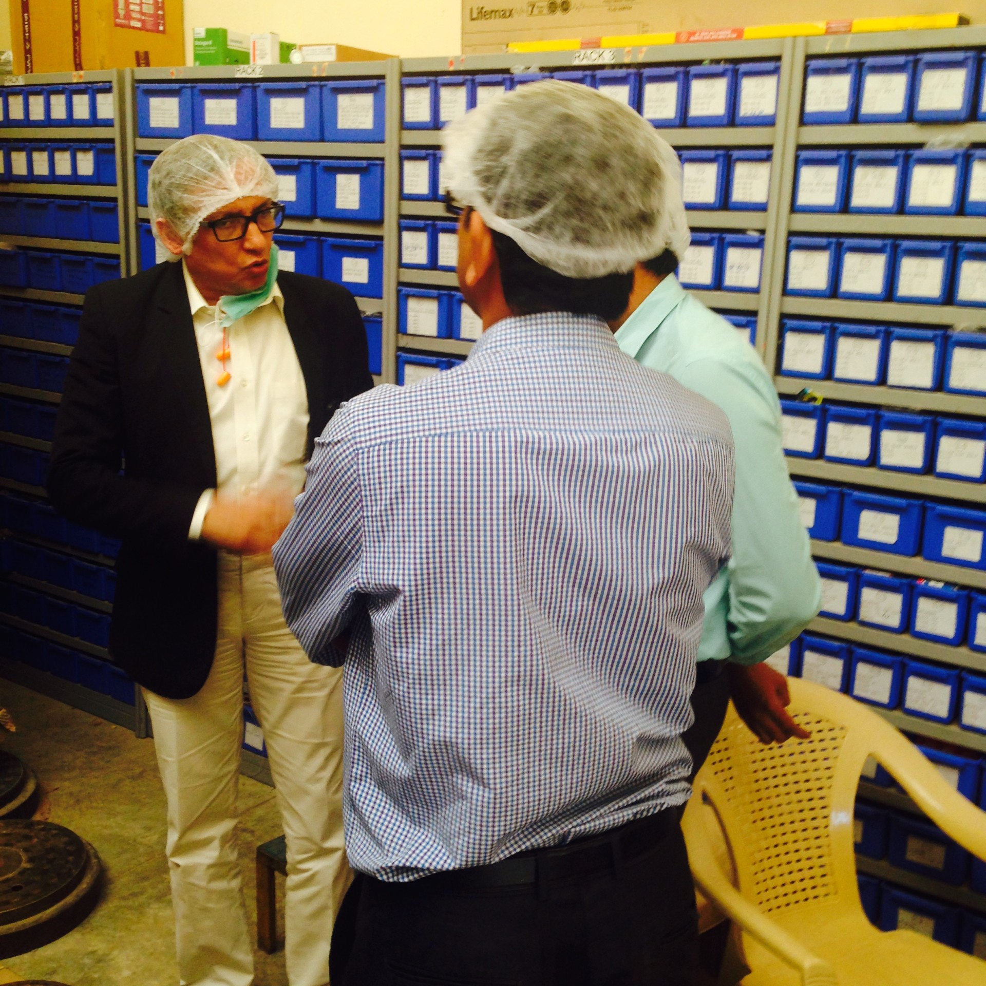 Dr. Uttam Kumar Chatterjee coaching a team on the factory floor